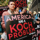 Activists hold a protest near the Manhattan apartment of billionaire and Republican financier David Koch on June 5, 2014, in New York City.
Spencer Platt/Getty Images